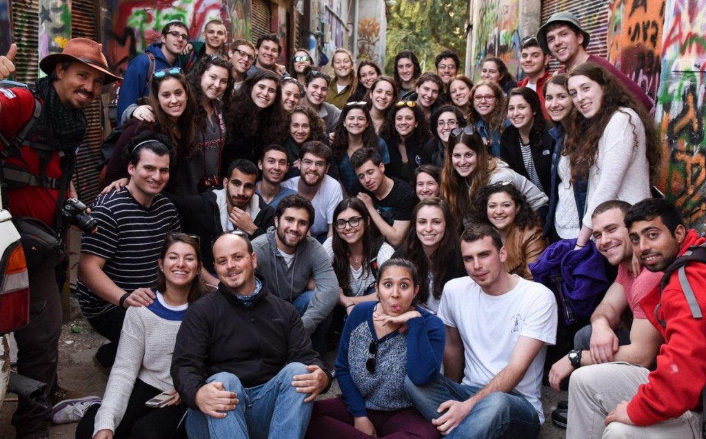 The entire group poses for a bus photo during a graffiti tour in Tel Aviv.