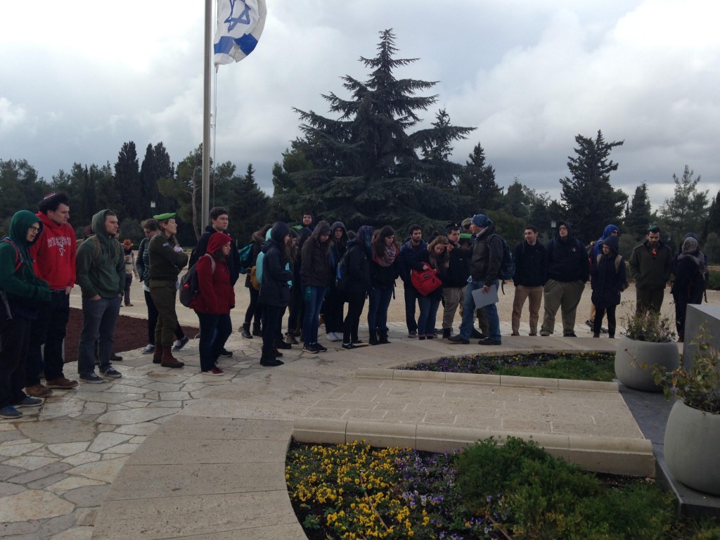 Standing outside of Theodore Herzel's grave, group members talk about Zionism throughout history. 